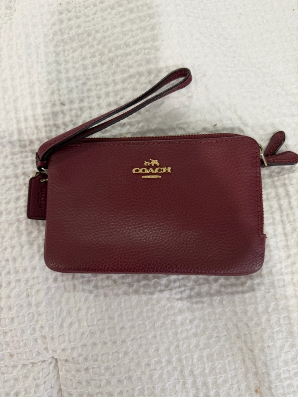 COACH Pebbled Leather Wristlet in Burgundy
